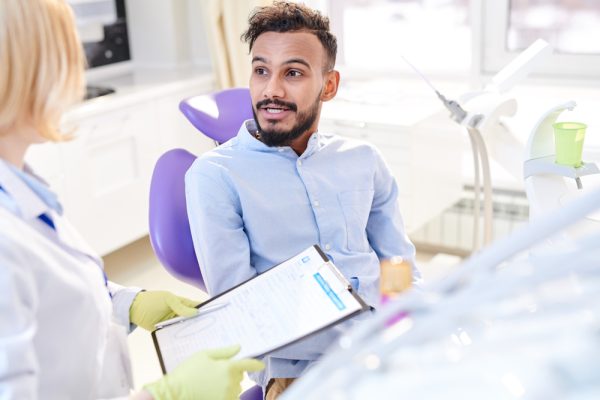 patient speaking with dentist